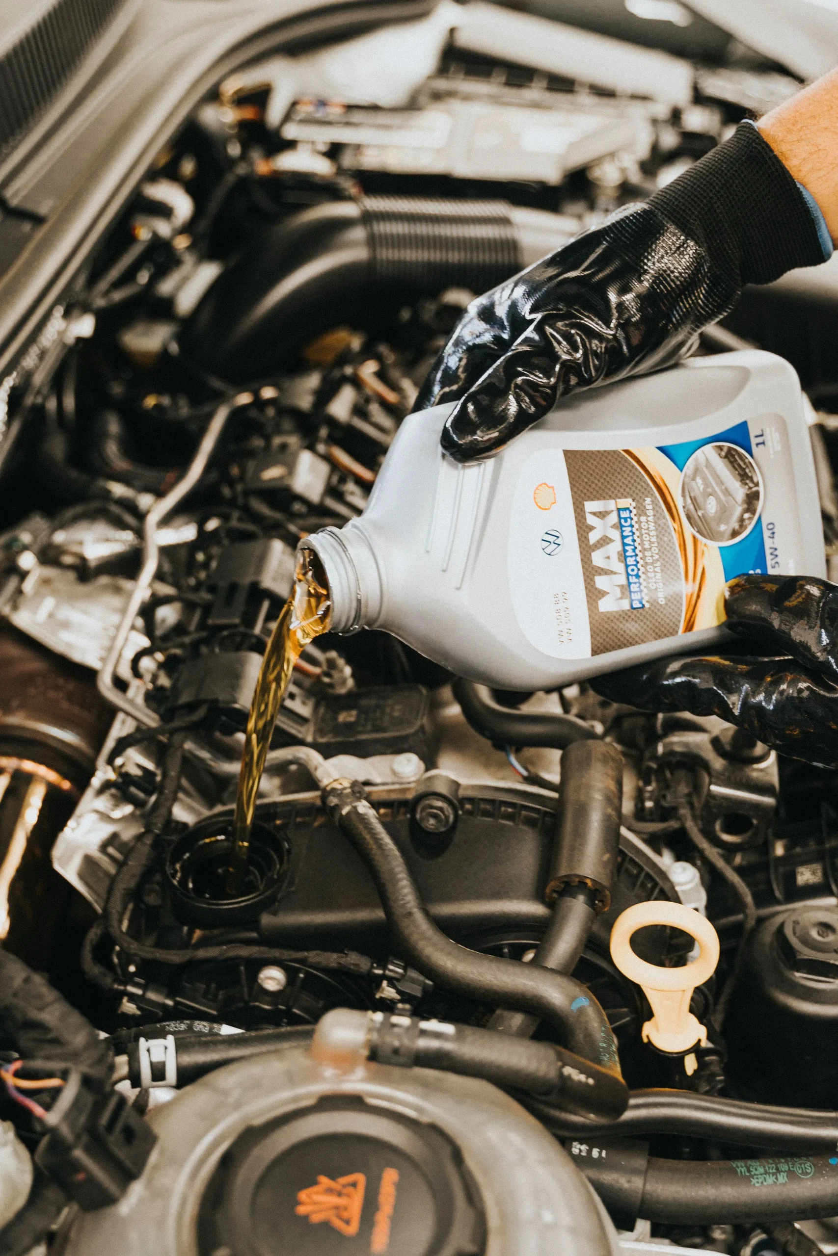 Bayanat Network technician performing an engine oil treatment service