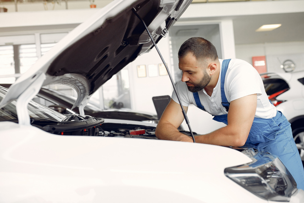 Technician performing a scheduled vehicle maintenance service