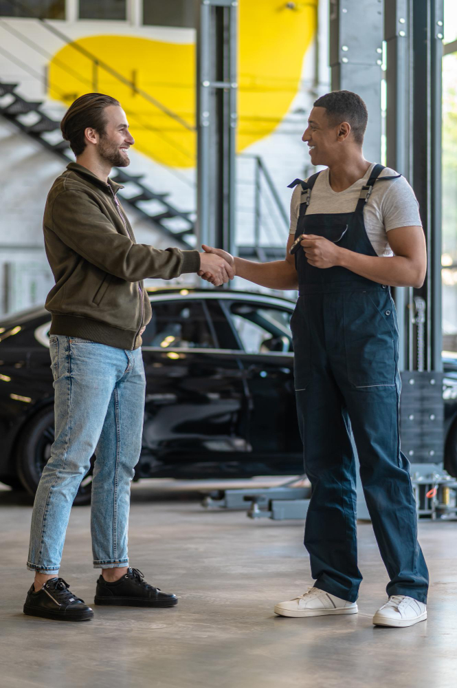 Technician carrying out fleet vehicle servicing in an approved workshop